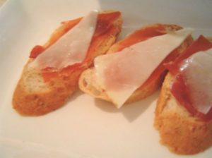 Manchego and serrano crostini